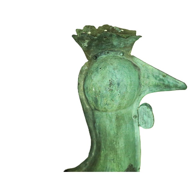 A mid 19th century French folk art copper weather vane in the form of a rooster. French weather vanes are markedly...