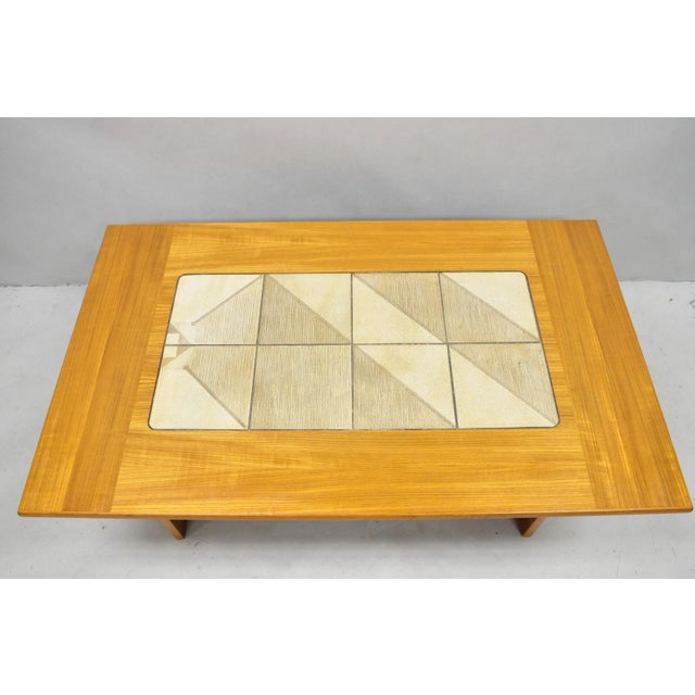 Vintage Gangso Mobler Mid Century Danish Modern Teak Tile Top Coffee Table with Angled Lower Shelf. Circa Late 20th...