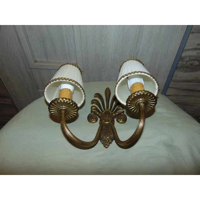 Vintage Brass Double Wall Lamp 1970s, dimensions: height 23.5 cm, width 25 cm, depth 13 cm. European Plug (up to 250V).The...