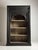 Very large and heavy Indian bookcase. Originally from India, late 20th century. In very good condition. Black exterior and...