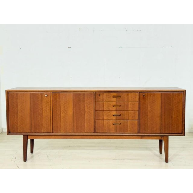 For sale is this excellent vintage sideboard made of high-quality teak, a true masterpiece of Scandinavian mid-century...