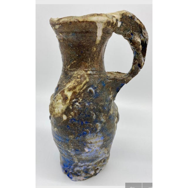 This unique and one-of-a-kind ceramic pitcher/vase done in the Brutalist style, makes a strong statement by virtue of its...