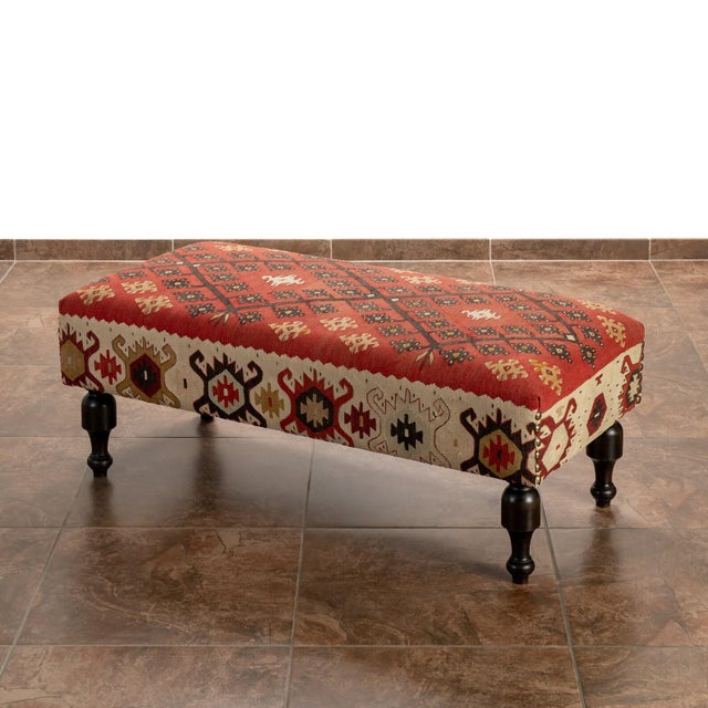 This large-scale bench integrates mid-century Anatolian textile history with heavy-duty woodworking. The primary surface...