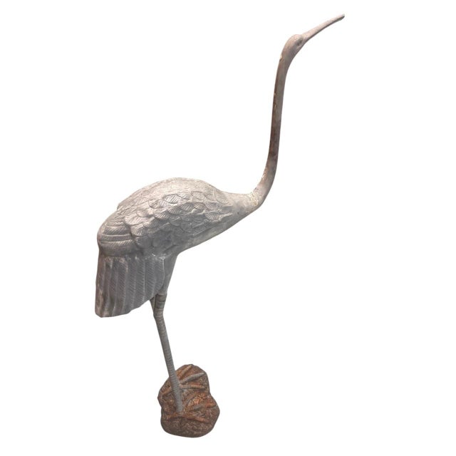 Bring a touch of classic, mid-century elegance to your landscape or sunroom with this striking vintage cast iron crane...