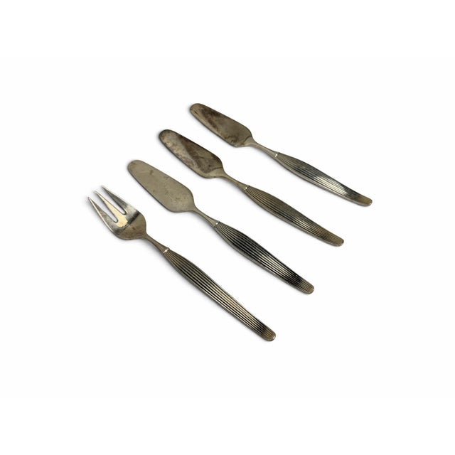 Complete your mid-century tablescape with this rare 4-piece set of specialty serving and accessory utensils in the iconic...