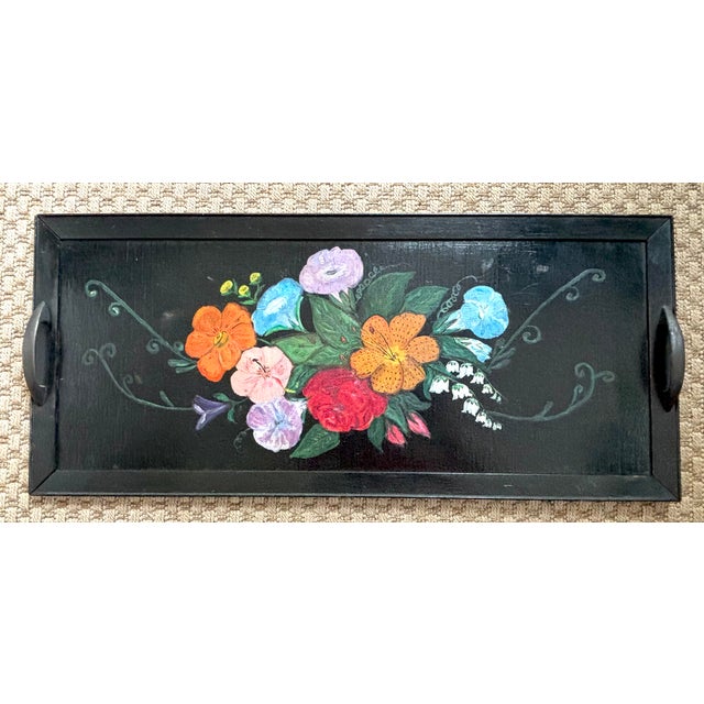 Hand-painted Folk Art floral tray with handles. Bright flowers pop against the black ground. Please see condition details...