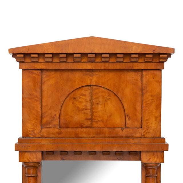 A striking Biedermeier mirror dating to the first half of the 19th century, distinguished by its beautifully figured warm-...