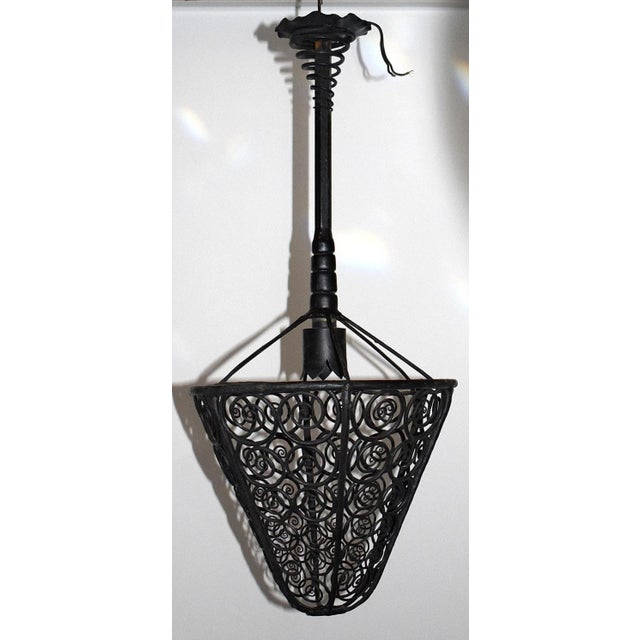 Heavy and massive ceiling lamp made of wrought iron from the time of Art Nouveau / Art Deco. The lamp was produced by...