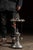 Cast metal smoking stand centered by a figural Statue of Liberty form, her raised torch converted into a glowing electric...