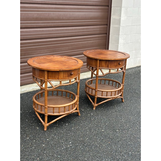 An interesting pair of 1990s faux bamboo, cane, and rattan tables. Tables could be used as large end tables, center...