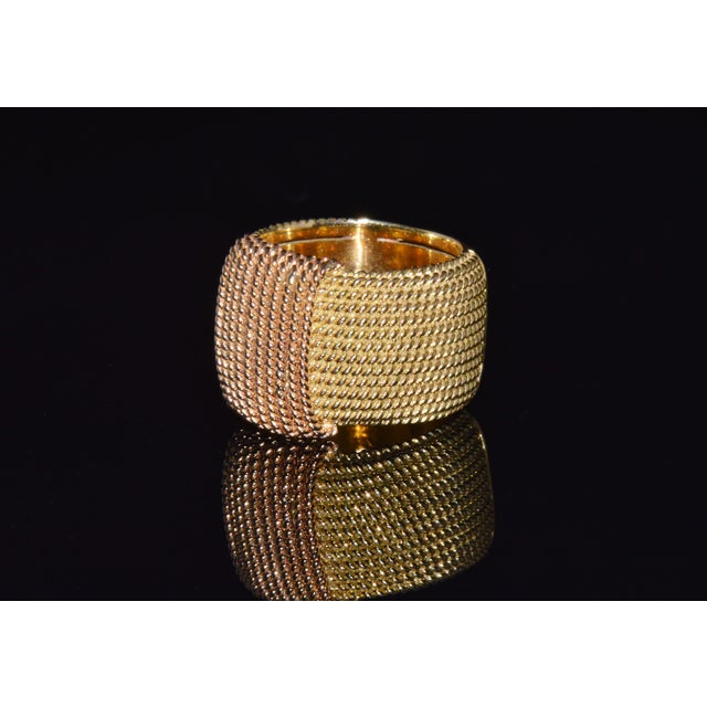 Authentic vintage Roberto Coin Opera solid 18K yellow and rose gold wide statement band ring. This elegant designer ring...