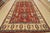 A tribal Caucasian Kazak rug hand-knotted with fine wool on a cotton foundation. This area rug features geometric...