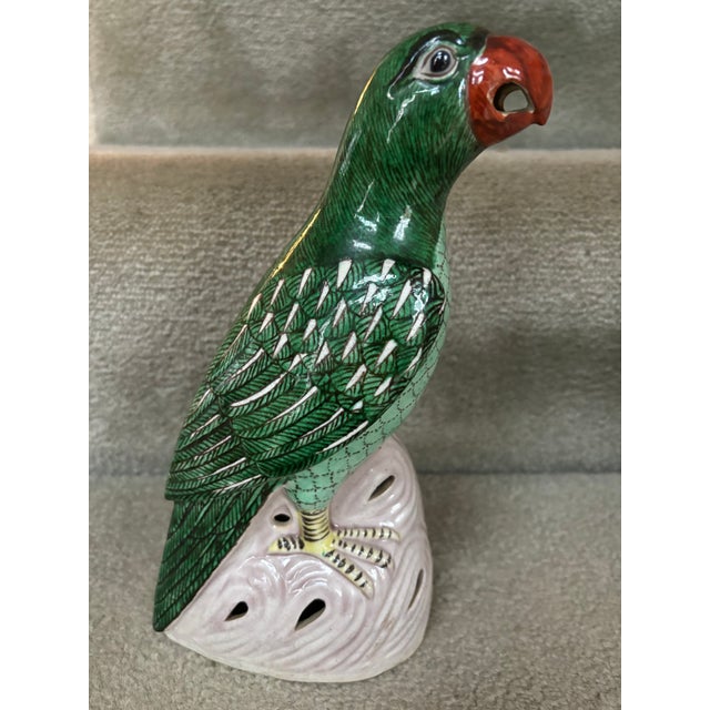 Antique Chinese Porcelain Parrot in Famille Vert Glaze or standing on a pierced rock work base with exceptional detail....