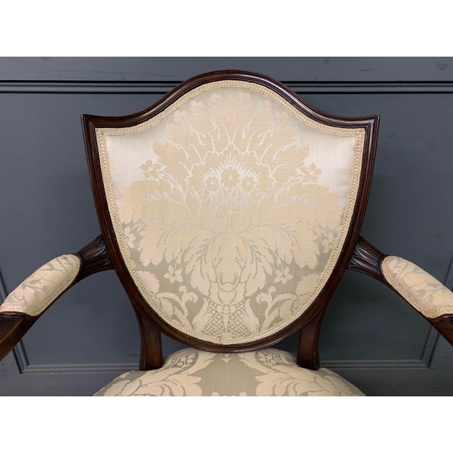 A charming Edwardian period Hepplewhite style mahogany armchair. Well constructed in solid mahogany and upholstered in...