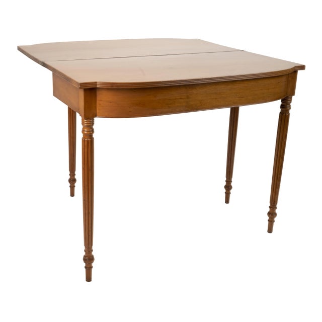 An American Classical Gate-leg Games/Card Table, early 19th C, probably Baltimore. The fold over top with reeded edge,...