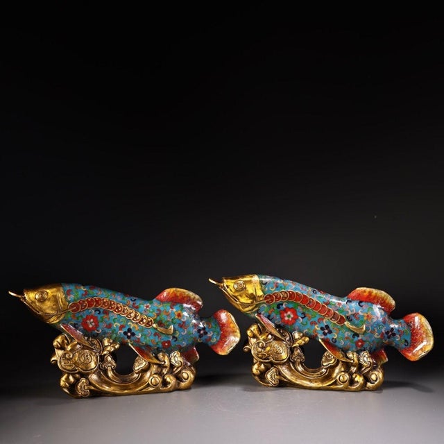 This is a matching pair of cloisonné enamel figurines in the form of large carp or koi fish, each featuring intricate...