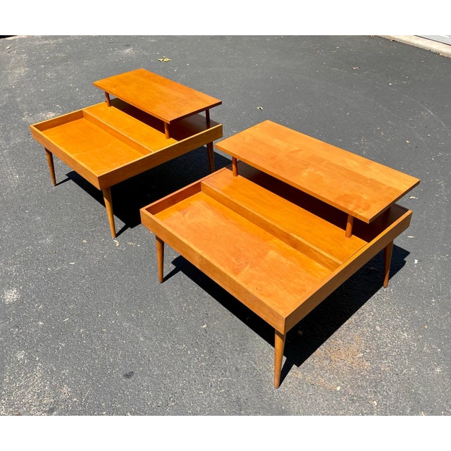 Bring iconic Mid-Century Modern design into your home with this beautiful, authentic pair of tiered side tables designed...