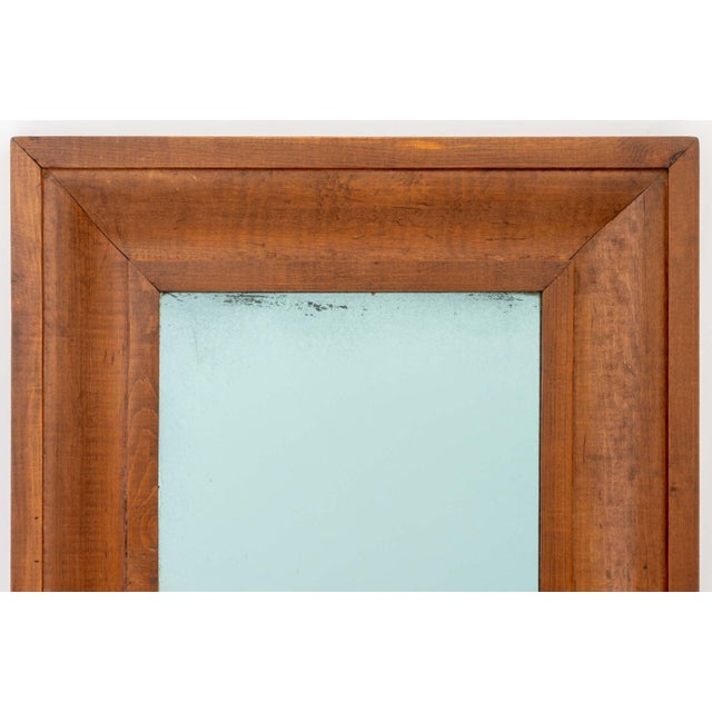 Modern Mahogany Framed Mirror. Mirror Plate: 17.75" H x 11.5" W; frame: 26.5" H x 20.5" W x 1.25" D. Provenance: From a...