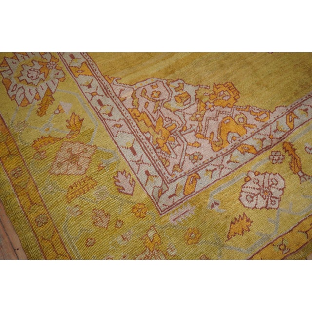 Sublime early 20th-century Turkish Oushak rug with a medallion and border on a gold field, accents in yellow, green,...