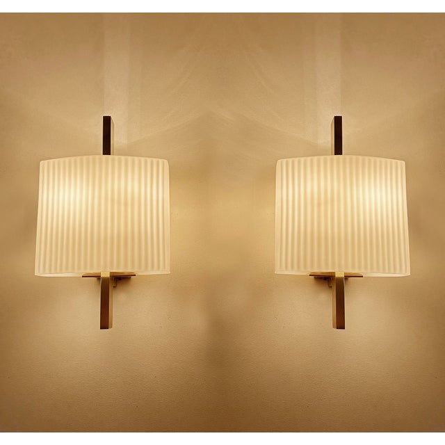 Pair vintage sconces, minimalist brass structure with convex shaped glass shades with a ribbed pattern dimensions: 10.23...