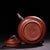 This is a charming vintage Chinese Yixing Zisha (purple clay) teapot, crafted from raw, unglazed red clay. The clay has a...