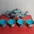 This is a charming vintage cloisonné enamel tea set, complete with one teapot and four matching teacups. Crafted from a...