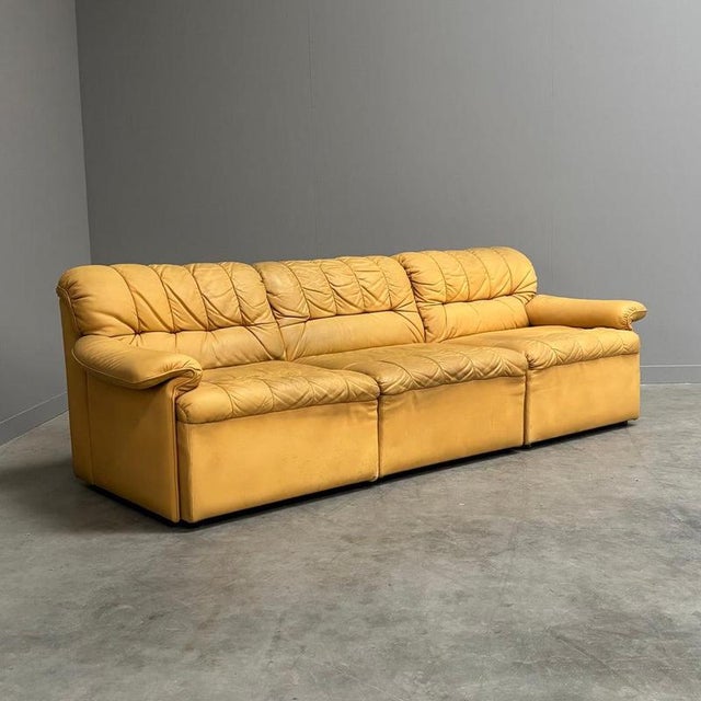 Remarks: Mid century element sofa by Laauser, Germany 1970s. Three elements upholstered in yellow leather. Actually the...
