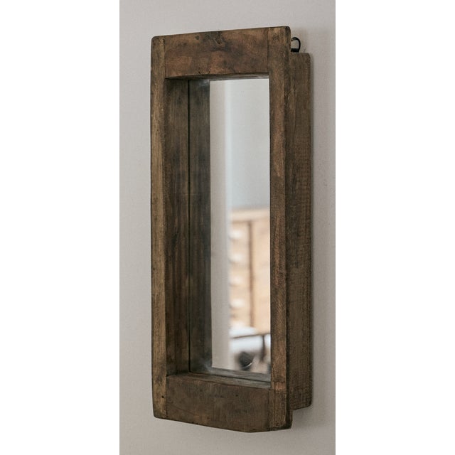 Rustic wooden mirror, wall hung. The mirror is set 2.5" deep into the rustic wooden frame, which has a hanging mechanism...