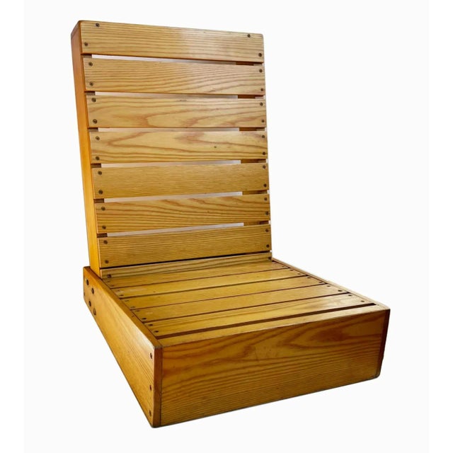 Pair of wooden chairs made from canoe seats. Label reads "Custom Designed by Sam's Canoe Seat and Racoon Salvage'. Great...