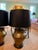 A stunning pair of brass table lamps with black lampshades, the perfect statement for a side table or a console table.