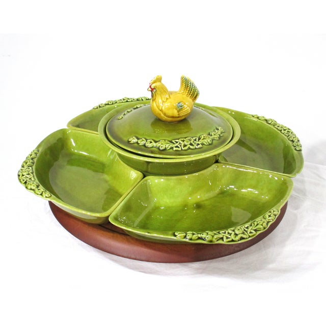 A unique 1950's-60's lazy Susan severing center piece with chicken motif having a pot with lid and a chicken as the...