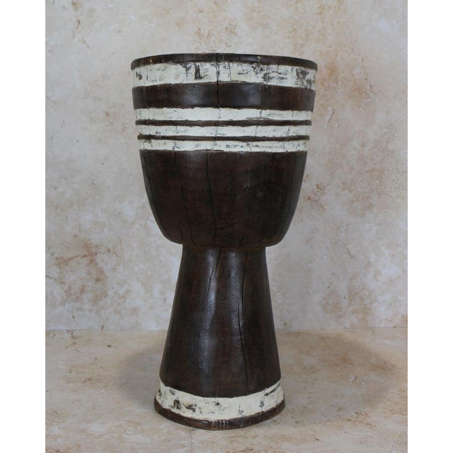 Introduce a touch of African elegance into your living space with this remarkable solid wood carved side tablestool from...