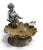 A charming and substantial vintage garden fountain hand-cast in solid lead. This piece features a seated cherub or putti...