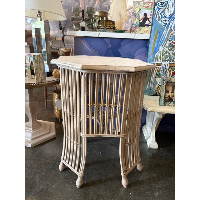 Charming vintage faux bamboo wicker side table featuring an airy open spindle base, turned feet, and a removable inset...