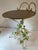 Love this Italian tole table with flowers and leaves and gold top. It could even be used as a small vanity stool.