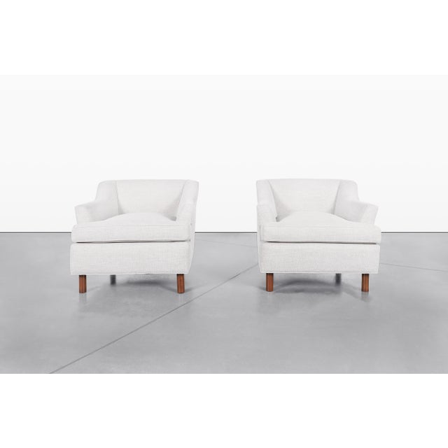 A timeless pair of mid-century lounge chairs manufactured in the United States during the 1960s. The design showcases the...