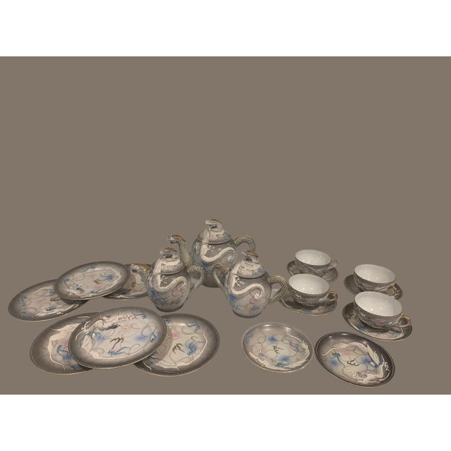 18- piece Japanese Dragonware moriage Nagoya Tea Service including: teapot, covered creamer, double-handled covered sugar,...