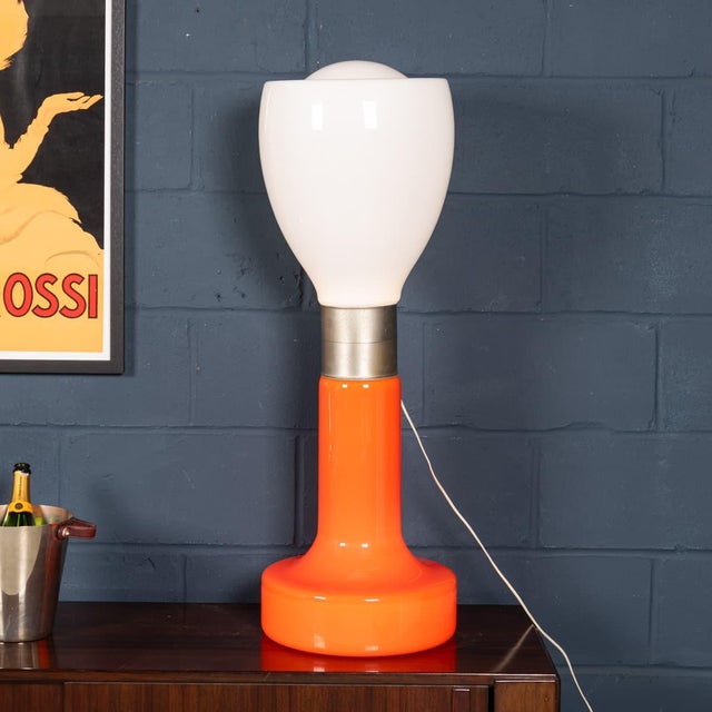 An iconic “birillo“ table lamp produced in Murano, Italy, during the 1970s, celebrated for its bold sculptural form and...
