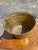 Antique spun brass bucket pail. Features an iron swing handle attached with original rivets/nails and a primitive patch...