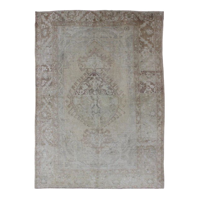 Earthy Tones Muted Turkish Oushak Rug With Faded Medallion Design For Sale