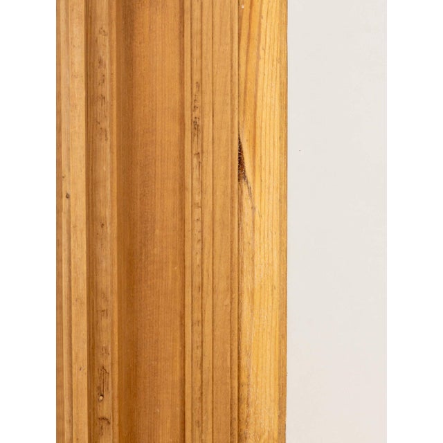Rustic Carved Pine Framed Mirror. Mirror plate: 16.5" H x 12.25" W; frame: 27.75" H x 23.5" W x 4" D. Provenance: From a...