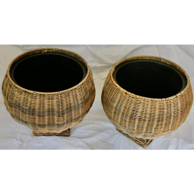 A Pair of Wicker Resin Urn Planters Indoor or Outdoor Plants. The Urn shape gives the Wicker a classic look. The plastic...
