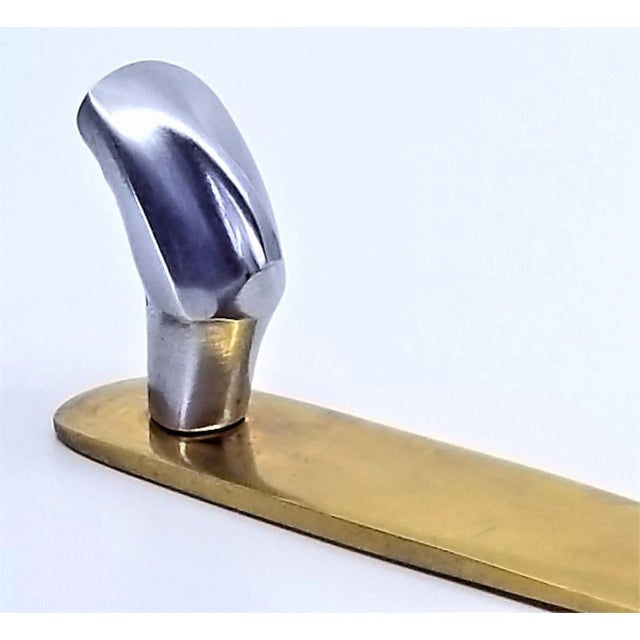 Offering a vintage heavy solid brass Cycladic letter opener with a three dimensional polished aluminum head or bust, circa...