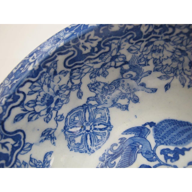 Lovely vintage Japanese porcelain bowl. Intricate blue design of birds, flowers, and Kirin. Bowl measures 9" wide x 3"...