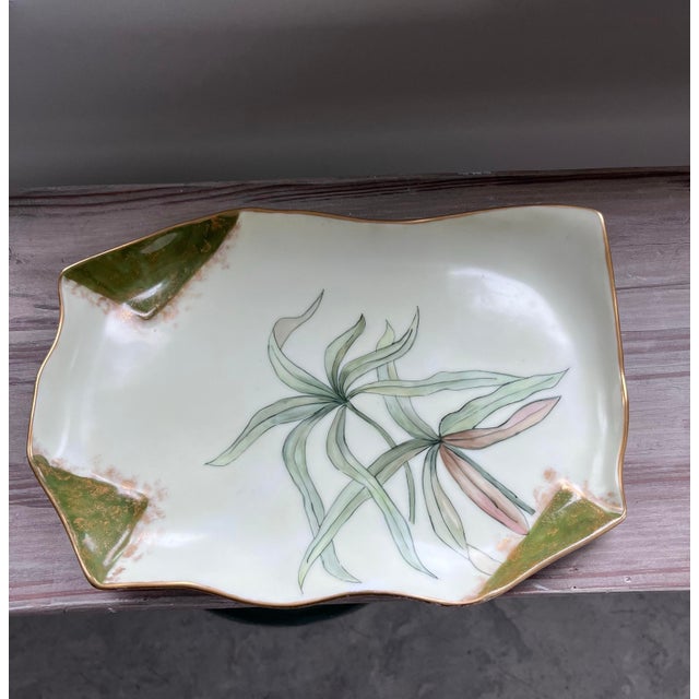 A beautiful, hand-painted, French jewelry tray decorated with flowing green leaves and gold and copper gilt accents....