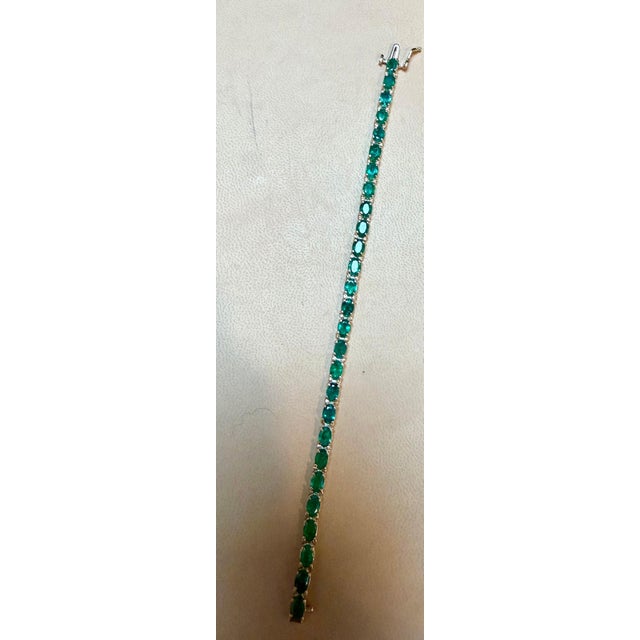 14 Carat Natural Oval Emerald Cut Cocktail Tennis Bracelet 14 Karat Yellow Gold This exceptionally affordable Tennis...