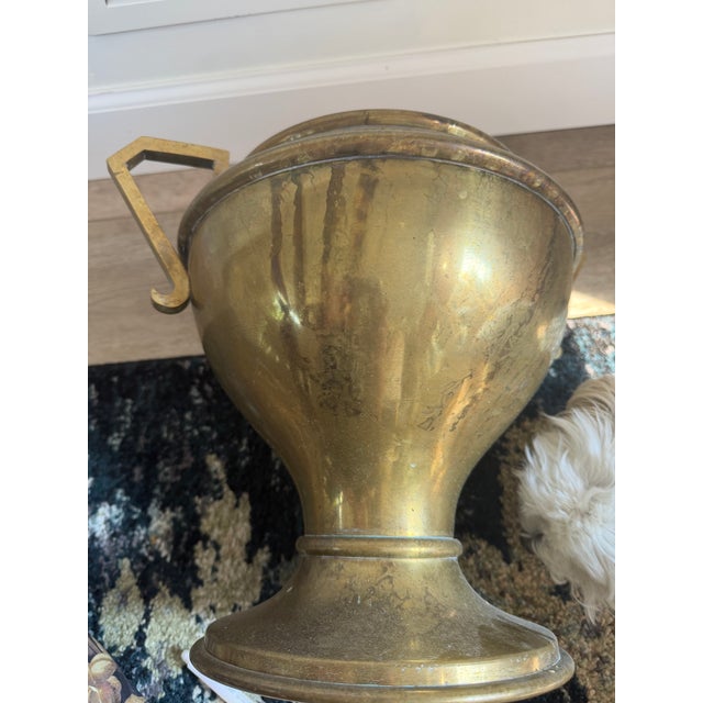 Add a touch of timeless warmth and elevated structure to your interior with this handsome solid brass pedestal urn...