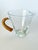 Incredible mid century pitcher with a cane/rattan wrapped handle in the design of Carl Auböck, in Austria, 1950s. In...
