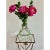 This vintage Hollywood Regency plant stand features a sculptural metal frame with a gilt finish and an ivy leaf motif. The...