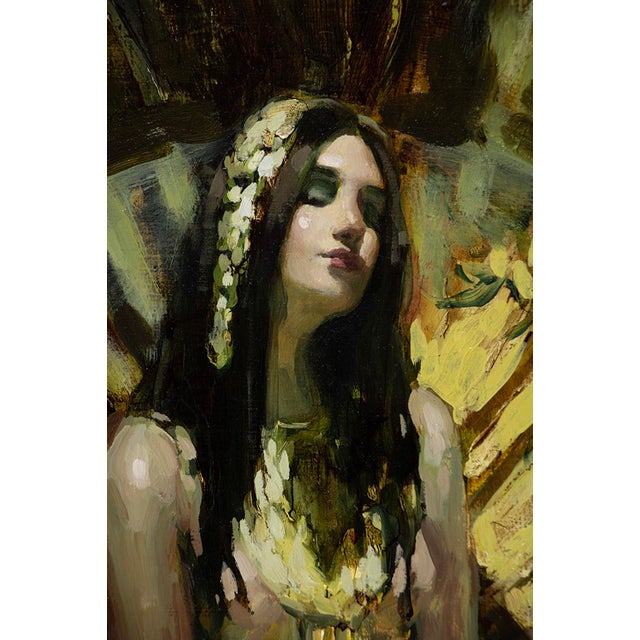 The artwork features a serene figure seated against a backdrop of sweeping golden fans, exuding an ethereal quality. The...